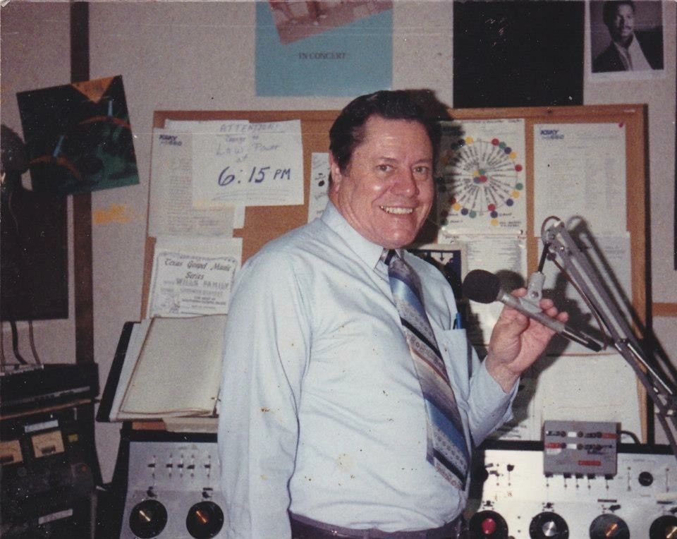 Bob Wilson in the KING Country radio studio holding a microphone