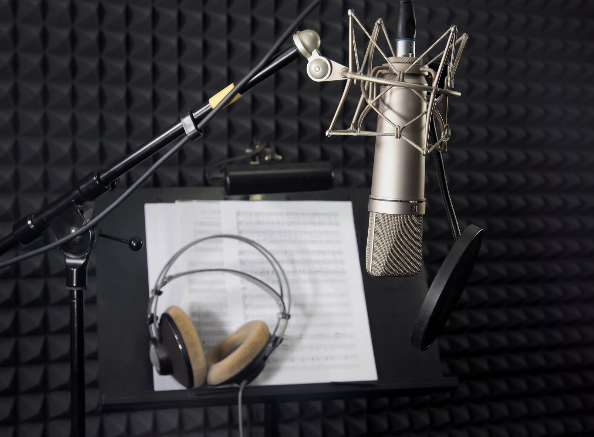 Vintage broadcast radio microphone in warm studio light